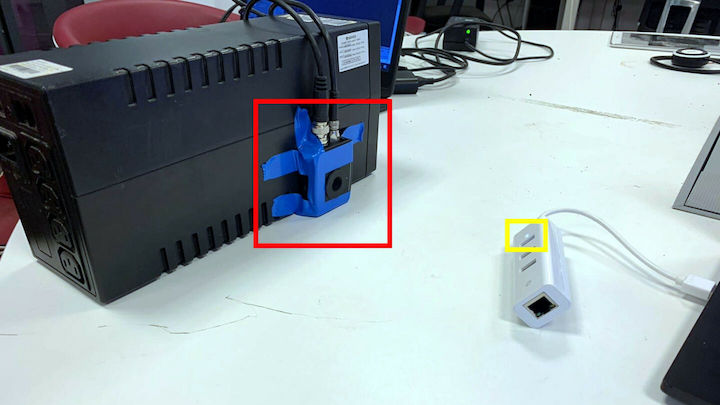 In this close-range proof of concept, a Thorlabs PDA100A2 electro-optical sensor (red) is aimed at a USB hub's power LED (yellow).